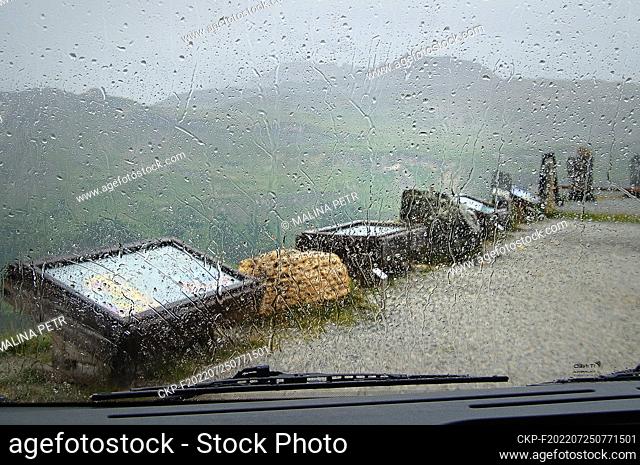 The top of the GroSglocknerstraSe high mountain road and a view through a wet car window at tourist information signs. (CTK Photo/Petr Malina)