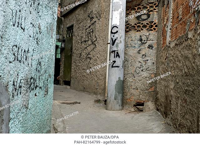 Paintings on the walls show that the CV (Comando Vermelho, red commando, one of the two big drug organisations) reigns here in the favela Complexo do Alemão in...