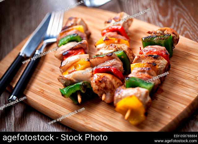 Chicken skewers on cutting board. High quality photo