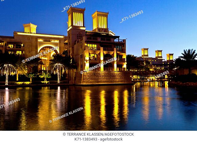 The Al Qsar hotel illuminated at night in the Madinat Jumeirah souq in Dubai, UAE
