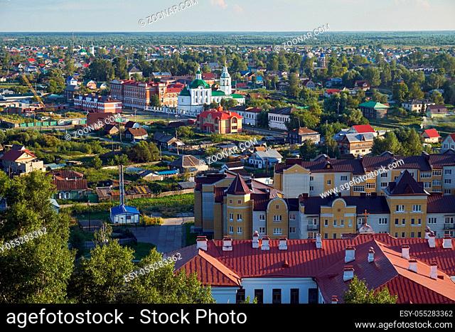View on the modern residential quarters with the foothills Church of St. Michael the Archangel in the piedmont near Tobolsk kremlin. Tobolsk. Russia