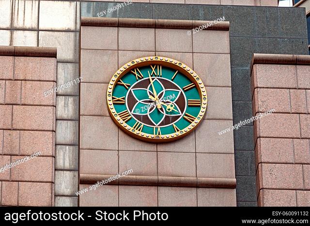 Green Clock With Golden Roman Numbers in Hong Kong