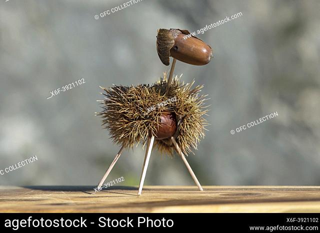 Sheep, funny animal figure made from chestnut shells and oak acorns in autumn time, Switzerland