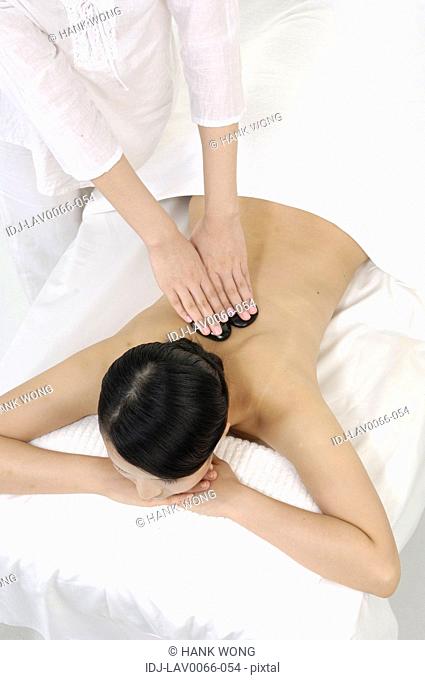 Young woman getting lastone therapy
