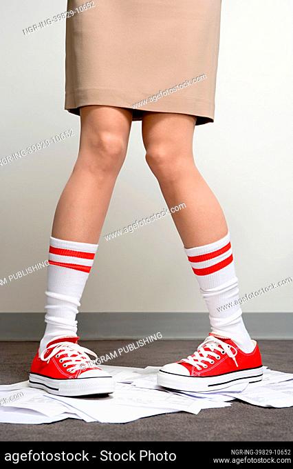 Female office worker wearing baseball boots