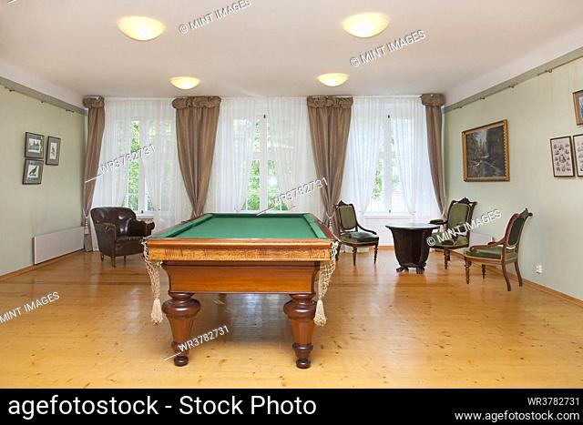 Pool table and furniture in a games room, hotel