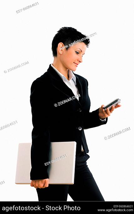 Happy businesswoman with mobile phone and laptop computer, smiling, isolated on white