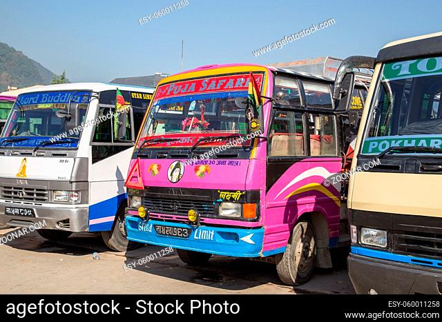 Kathmandu, Nepal - October 22, 2014: Several colorful buses parked at a tourist bus station