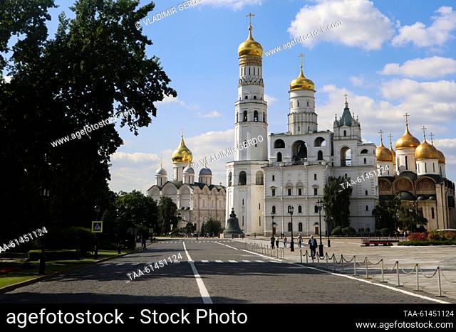 RUSSIA, MOSCOW - AUGUST 28, 2023: A view of the Ivan the Great Bell Tower, the Cathedral of the Archangel and the Dormition Cathedral at the Moscow Kremlin