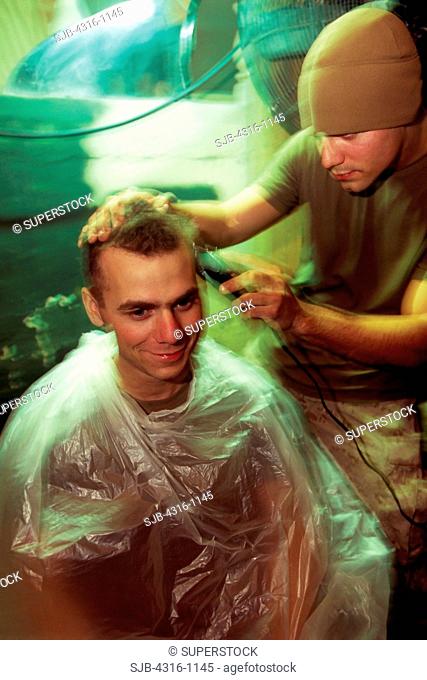 Marine Gets a Haircut at a Combat Outpost in Barwana, Iraq