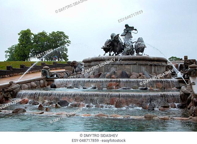 Gefion Fountain, Copenhagen, Denmark. Statue of man riding bulls by a fountain in the city of Copenhagen, Denmark. Gefion fountain is the largest fountain in...