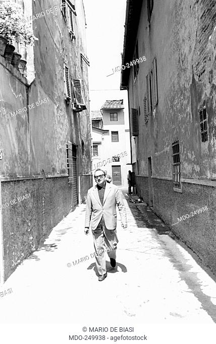 Initiator of the New Realism and co-founder of the avant-garde literary journal Field of Mars, Italian novelist Vasco Pratolini peacefully walks throught a...
