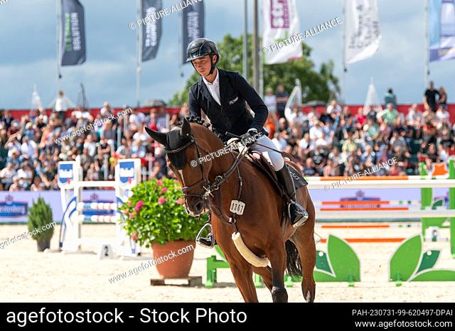 30 July 2023, Baden-Württemberg, Donaueschingen: Equestrian Sports/Jumping: Bemer Riders Tour, Donaueschingen: Sönke Aldinger with his horse Cappuccino Z in...