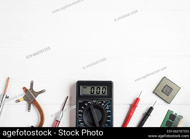 high angle view electronic tools with computer chips wooden background