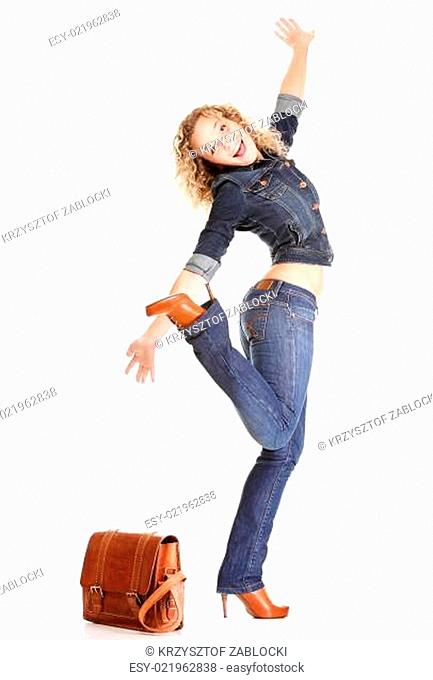 Beautiful young woman blonde standing full body in jeans isolated
