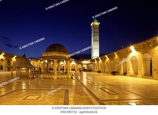 Empty courtyard of Great Omayyaden (Umayyad) Mosque in the late evening with light and dark blue sky, Aleppo, Syria, Middle East, Asia