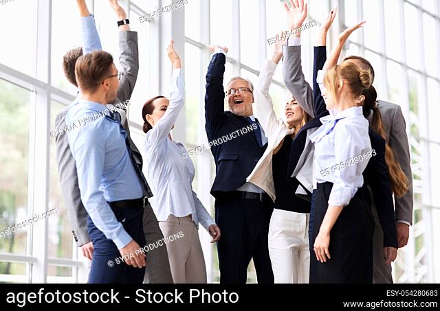business people celebrating success at office