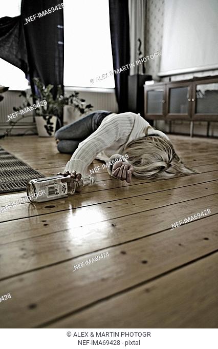 A drunken woman lying on the floor, Sweden