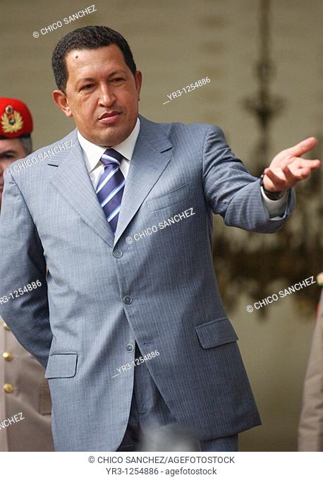 Venezuela's President Hugo Chavez salutes to journalists in Miraflores Palace in Caracas, Venezuela