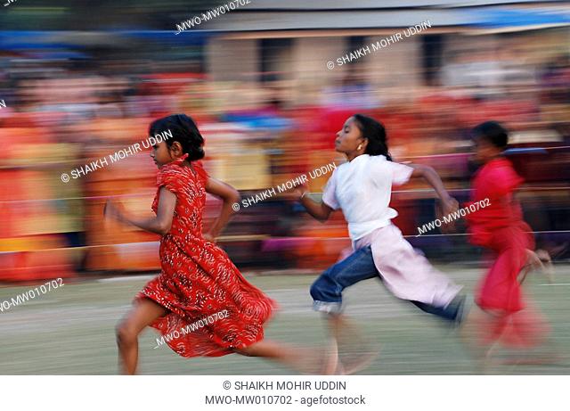 Children racing at a sports festival in Mujgunni, Khulna, Bangladesh December 22, 2007