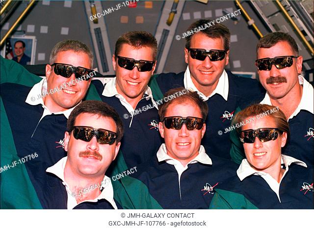 The seven member crew of the STS-90 Space Shuttle Columbia Neurolab mission pose for a group photo. (Front row, left to right) Scott D
