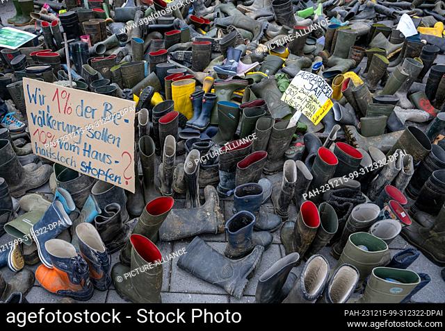 12 December 2023, Bavaria, Kempten: More than a thousand rubber boots lie in front of the FDP district office. In a state-wide day of action