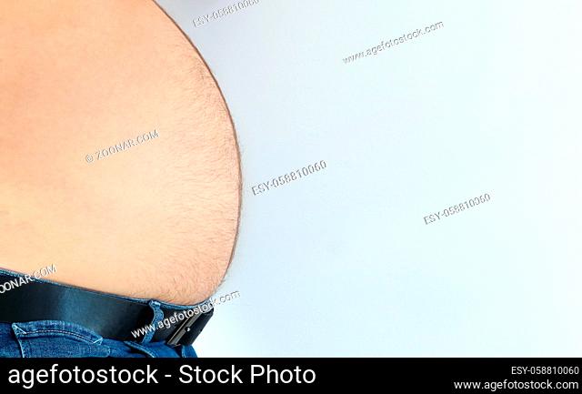 Naked fat belly of fourty years old man in jeans