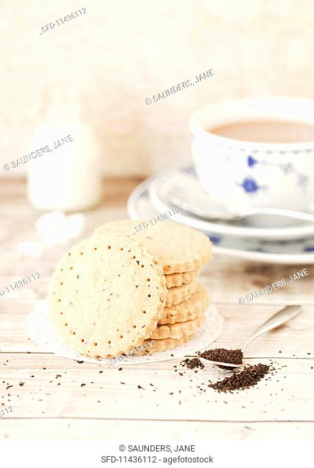 A stack of chai tea shortbread biscuits served with a cup of tea