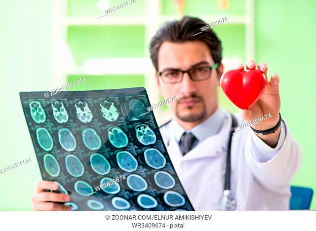 Doctor radiologist looking at x-ray scan in hospital
