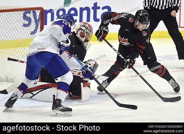 L-R Robert Dzugan (SVK), Joel Hofer and Bowen Byram (both CAN) in action during the 2020 IIHF World Junior Ice Hockey Championships quarterfinal match between...