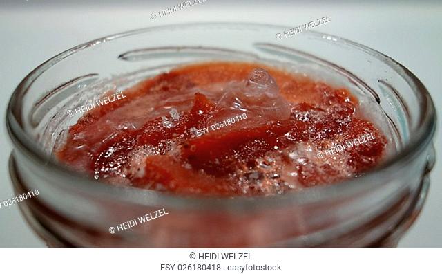 iced strawberry jam and kiwimarmelade in glass