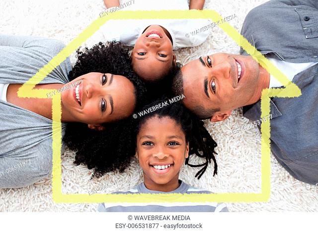 Composite image of smiling young family lying on floor