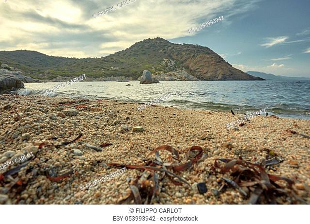 Shooting from the ground of a typical central Mediterranean beach: magnificent seascape with the sand of the beach in the foreground with the sea and the...