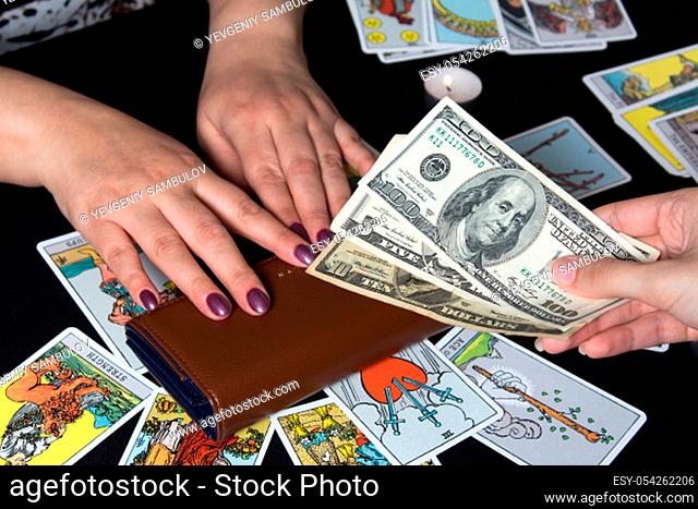 Bangkok, Thailand, november.17.19. Magic ritual on money dollars. Attracting money with the help of magic. Magical sessions with the cards