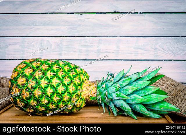 Eco pineapple on a wooden table with linen
