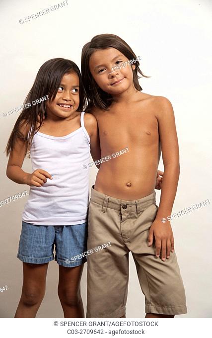 A Native American boy and girl, both members of the Acjachemen tribe, pose as an affectionate couple. . MODEL RELEASE