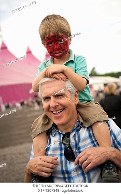 Grandfather carrying his grandson on his shoulders at the National Eisteddfod of Wales, Ebbw Vale 2010