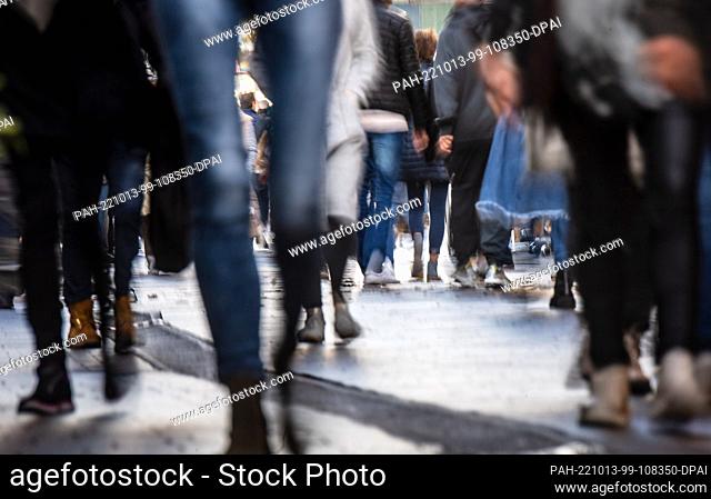 PRODUCTION - 07 October 2022, Bremen: Passers-by walk through the city center. The representative study ""The Fears of the Germans"" will be presented in Berlin...
