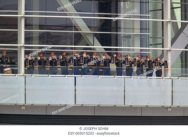 A military band of trumpeters performs on the balcony of the Clinton Presidential Library. Former U.S. President Bill Clinton will officiate the opening of his...