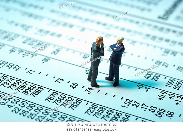 Miniature Businessmen on Stock Page