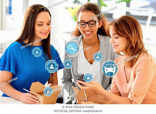 businesswomen using car sharing app on smartphone
