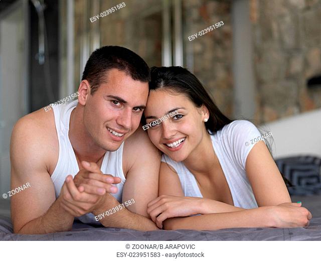 couple relax and have fun in bed