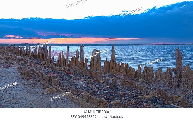 Sunset on the salty estuary Kuyalnik, dead lake near Odessa, Ukraine