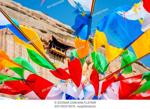 Mati Si cave temple with colorful praying buddhist flags, Zhangye, Gansu province, China