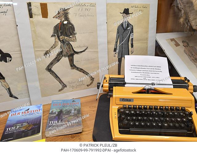 An old typewriter and drawing of costumes belonging to Lutz Jahoda, German actor, entertainer, singer and author, who was especially popular in the GDR