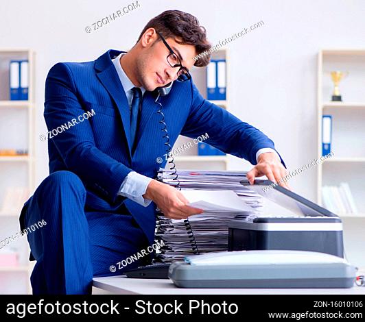 The businessman making copies in copying machine