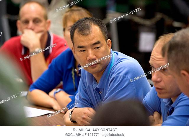 Japan Aerospace Exploration Agency (JAXA) astronaut Soichi Noguchi (center), Expedition 2223 flight engineer; NASA astronauts Clay Anderson (background) and...