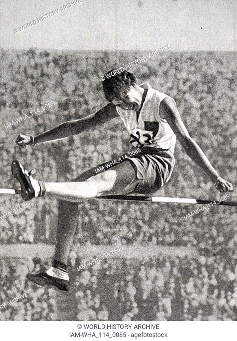 Photograph of Carolina Anna ""Lien"" Gisolf from the Netherlands High jumping at the 1932 Olympic games. She finished fourth