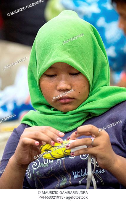 A former street kid sews at a workshop in Jakarta,  Indonesia, 03 November 2014. Actress Natalia Woerner supports Kindernothilfe