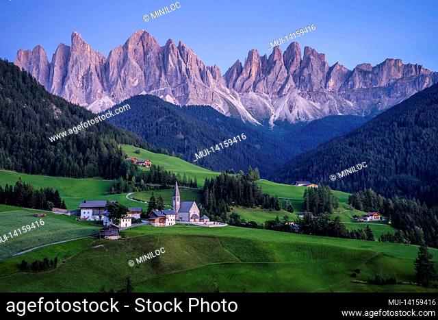 st magdalena church in val di funes valley, dolomites, italy. furchetta and sass rigais mountain peaks in background